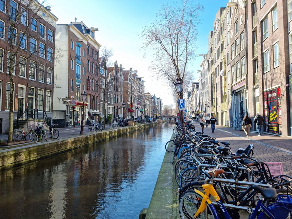 Bicycles parked along an Amsterdam canal