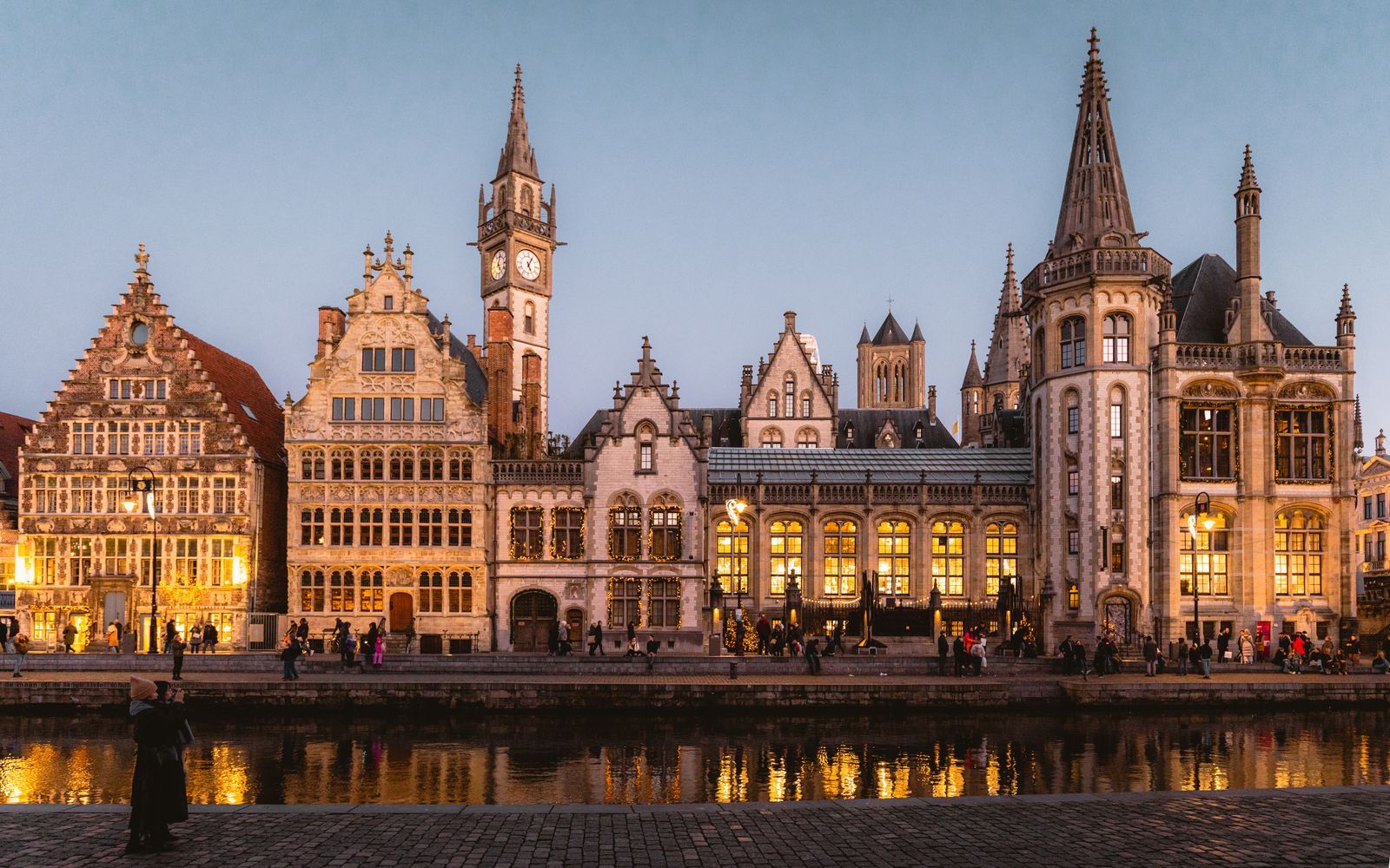 Ghent's old guild houses reflected in the canal at dusk