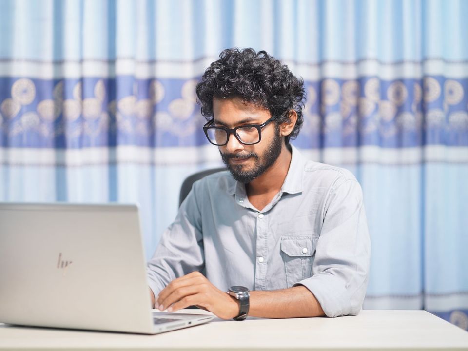 A data student working on a laptop