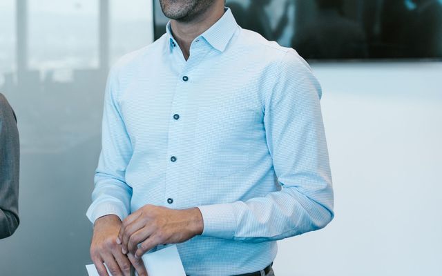 A young professional presenting a plan to his team