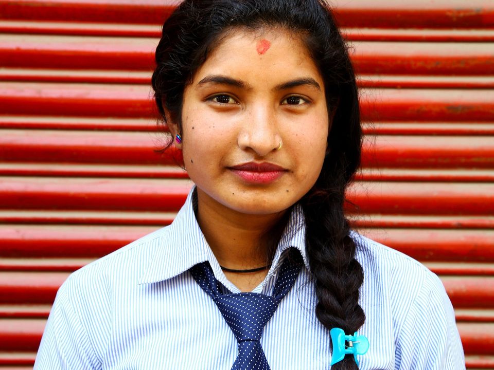 A Nepali +2 student in her college uniform