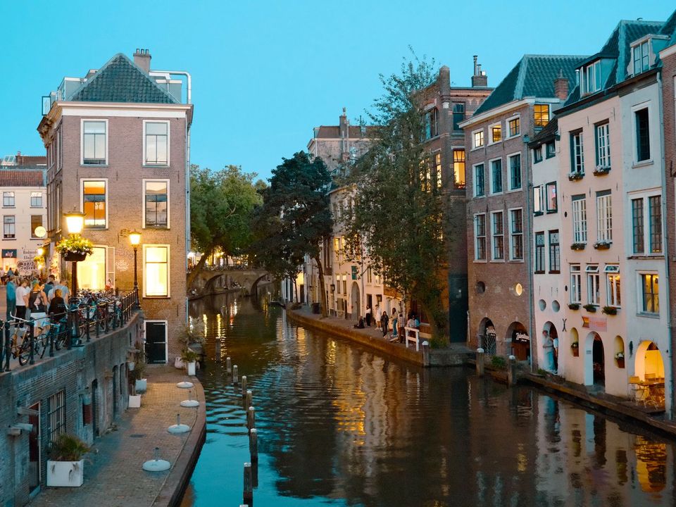 Utrecht's canal and old houses lit up in the evening