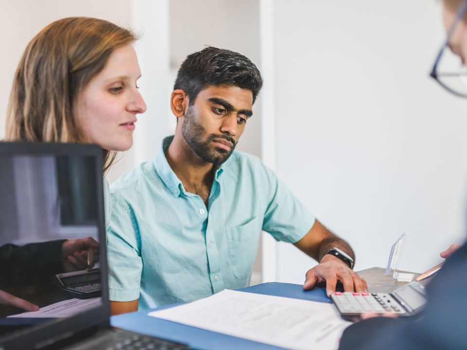 A student going through papers with an advisor