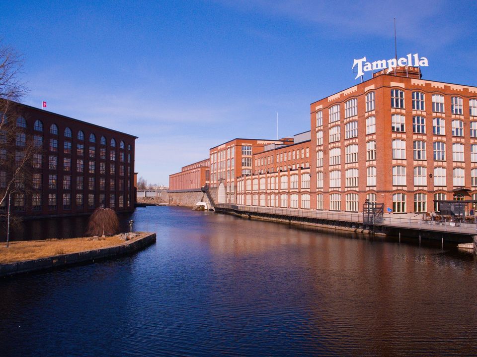 Red-brick buildings beside the rapids in Tampere